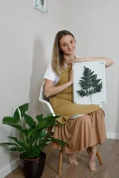 Master of the frame of flowers. Framing dried plants. Stock Photos