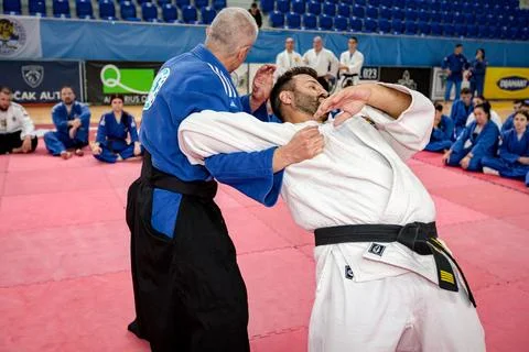 Master gives a lesson to his students in real aikido technique moves martia.. Stock Photos