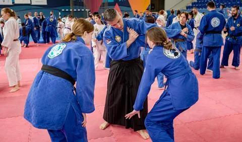 Master gives a lesson to his students in real aikido technique moves martia.. Stock Photos