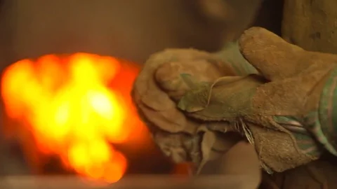 Master in gloves in the workshop Stock Footage 75746831