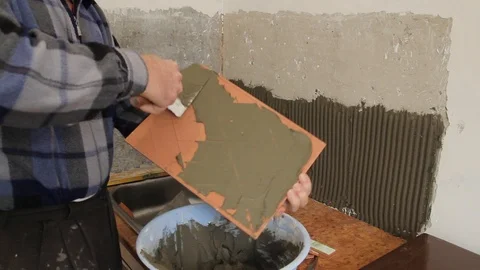 Master glues the tile on the wall. Stock Footage 101685452