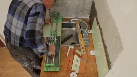 Master glues the tile on the wall. Stock Footage 101685461