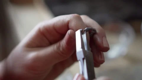 Master goldsmith working process. Craft jewelry, making a silver ring jewelry Stock Footage 141034369
