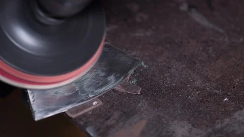 Master grind the surface of the axe Stock Footage 129044894