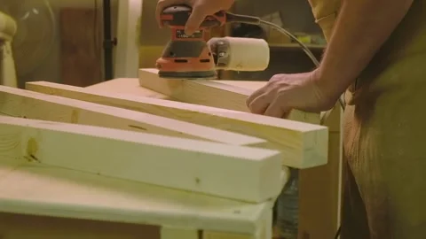 The master grinds the boards cut with a circular saw with a grinding machine Stock-Footage 182226145