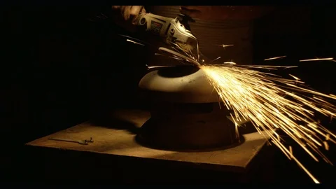 Master grinds the metal workpiece Stock Footage 95776182