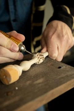 The master grinds a pattern on wood Stock Photos