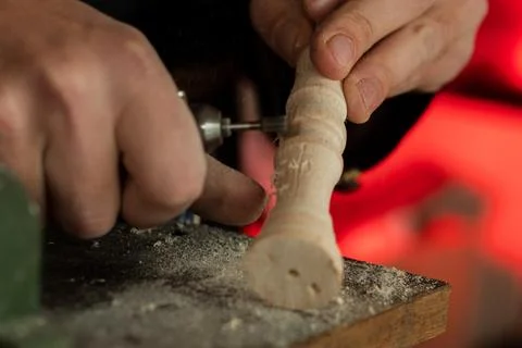 The master grinds a pattern on wood Stock Photos