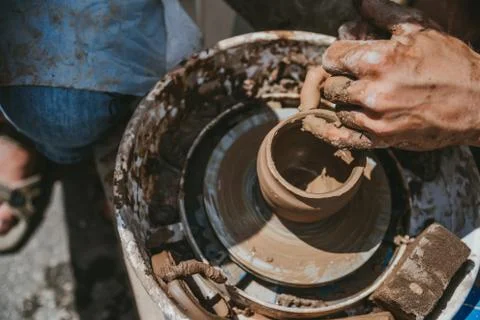 Master hands makes a pot of clay. Master class is held in nature, close-up Stock Photos