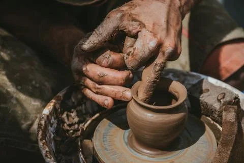Master hands makes a pot of clay. Master class is held in nature, close-up Stock Photos
