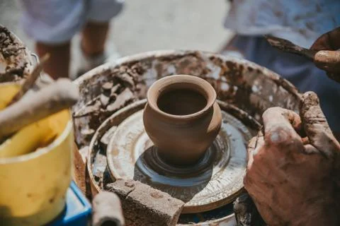 Master hands makes a pot of clay. Master class is held in nature, close-up Stock Photos