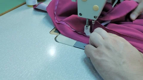 Master hands while sewing new clothes Stock Footage 94158090
