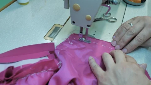 Master hands while sewing new clothes Stock Footage 94158262