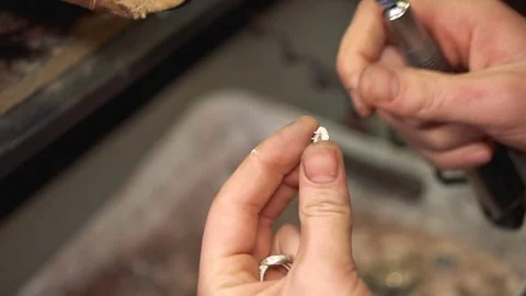 Master holds in his hands and polishing the finished product using a special Stock-Footage 72966854