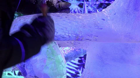 Master ice compositions performs notches and grooves in the piece of transparent Stock Footage 66318545