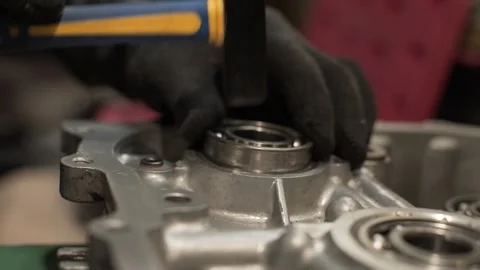 Master inserts bearing into gearbox Stock Footage 270695225