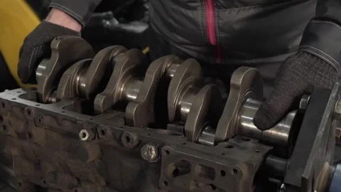 Master inserts crankshaft into engine Stock Footage 270691852