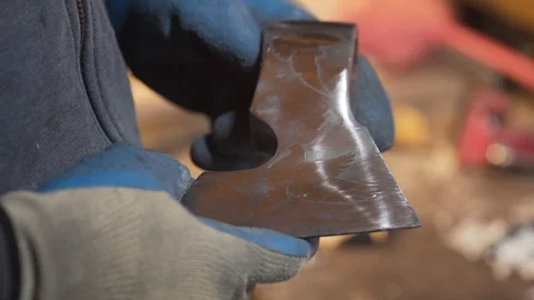 Master inspects the billet for the axe Video stock 129693680