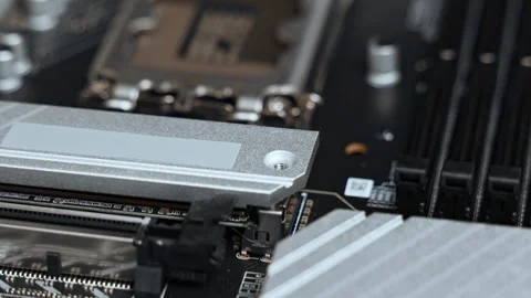 The master installs a cooling radiator for SSD m2 sata on the motherboard. PC Stock Footage 300192981