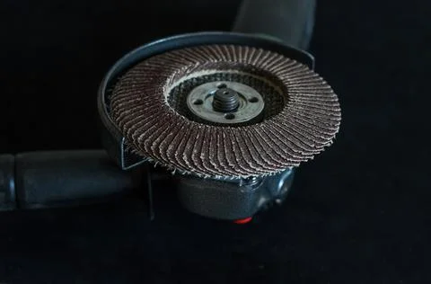 The master installs the cutting wheel in the angle grinder Stock Photos