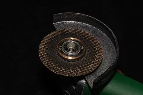 The master installs a disc on an angle grinder Stock Photos