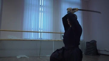 Master Kendo Performs Kata, Repeats Cutting Strikes with Sword for Workouts Stock Footage 85894968