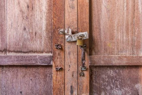 Master key on wood door and key knob Stock Photos
