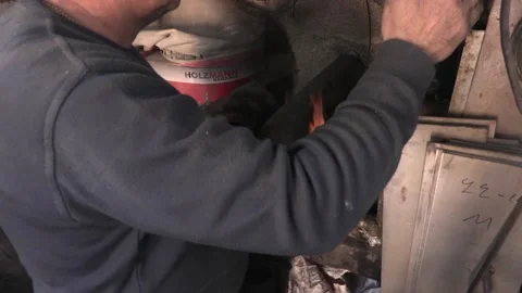 Master knife blacksmith Michael Paxtikos working in his knife workshop. Stock Footage 195807411