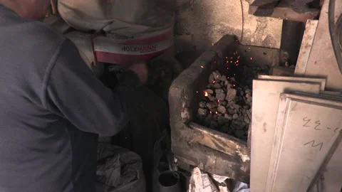 Master knife blacksmith Michael Paxtikos working in his knife workshop. Stock Footage 195807557