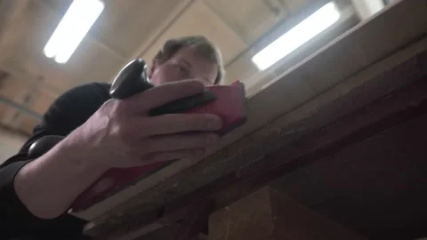 Master leveled the edge of the Board to the surf Board Video stock 132346515