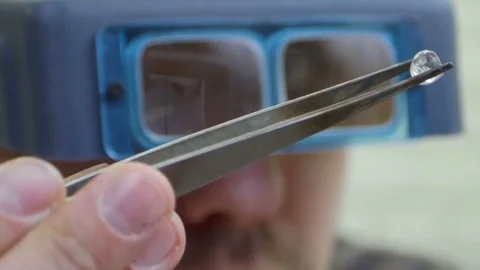 Master looking at the brilliant through glasses Stock Footage