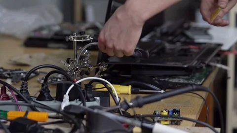 Master is looking at processor under a magnifying glass Stock-Footage 70551494