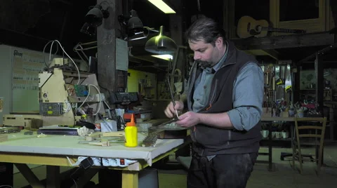 Master luthier guitars at work Video stock 60586880
