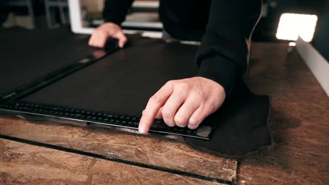 The master makes a cut for sewing a leather bag Stock Footage 151207806