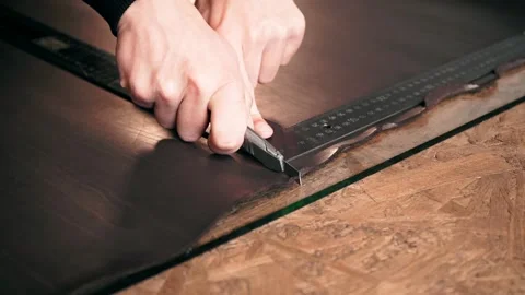 The master makes a cut for sewing a leather bag Stock Footage 151207821