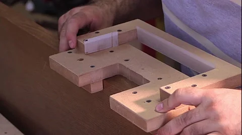 Master makes doors - setting the conductor Stock Footage 65467008