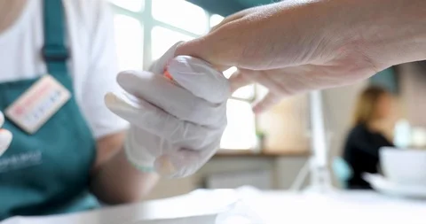 Master makes hand massage after manicure Stock Footage 107646676