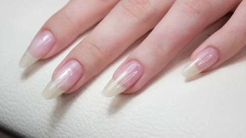 The master makes hygienic manicure to the client in the nail salon. Beautiful Stock Footage 133968178