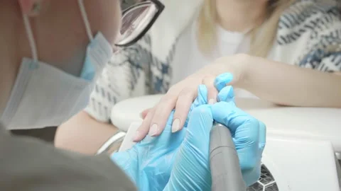 The master makes a manicure to the client Stock Footage 195732197