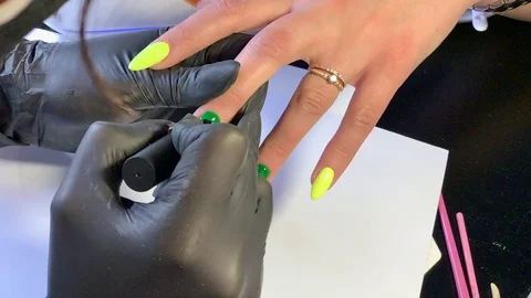 Master makes a manicure client. Hands - close-up. Stock Footage 107534047