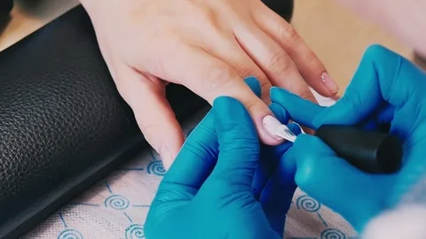 Master makes a manicure close-up Stock Footage 76708447