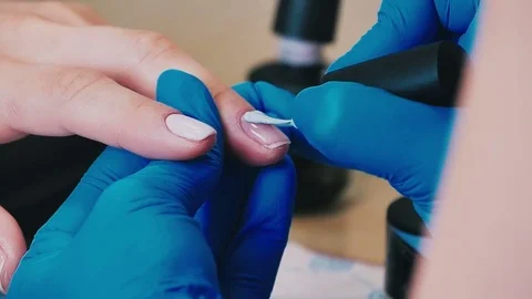 Master makes a manicure close-up Stock Footage 76708840