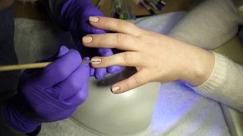 Master makes a manicure for nail care Stock Footage 236989090