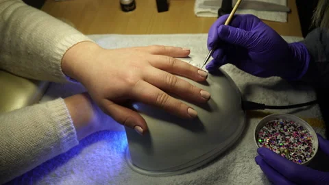 Master makes a manicure for nail care Stockbeeldmateriaal 236989170
