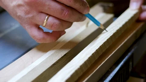 The master makes markings on the board with a pencil Stock Footage 177003322