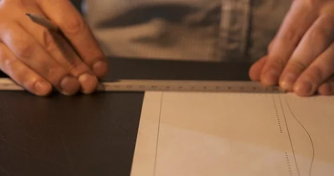 Master Makes Pattern for Product, Hands Marks on White Paper, Using Ruler Marks Stock Footage 129565200