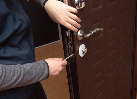 Master makes repairs changes lock in doors Stock Photos
