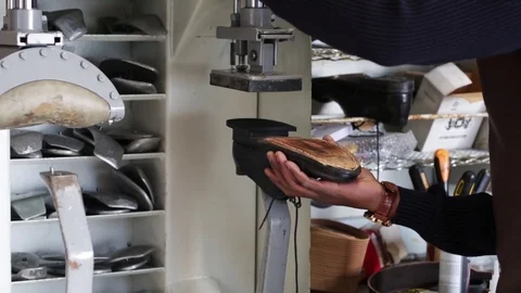 The master makes shoes in the workshop. Stock Footage 104984262