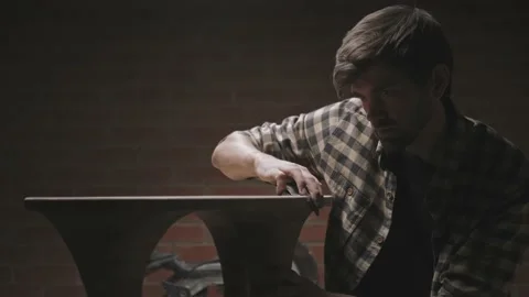Master makes a table in workshop, polishes wood for smoothness. Video stock 144522654