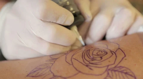 Master Makes Tattoo On Back Stock Footage 38385686